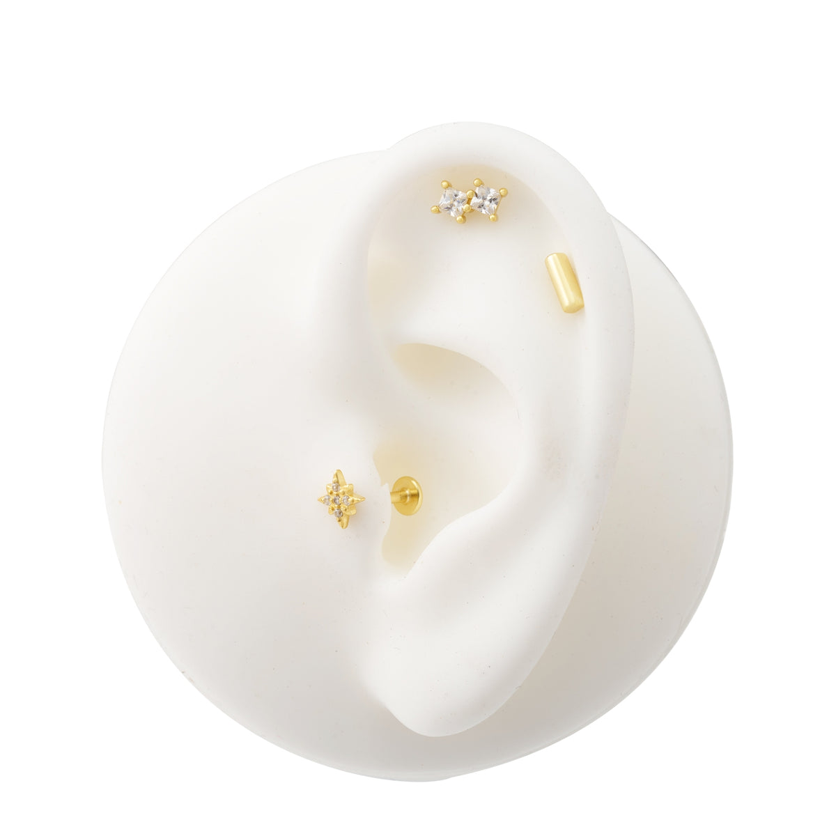 Zlatý piercing hvězda