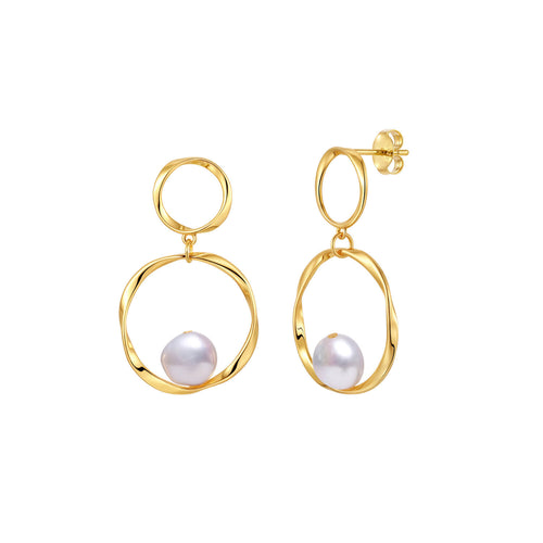 A pair of gold drop earrings with a double-ring design and a small white freshwater pearl set inside each ring.